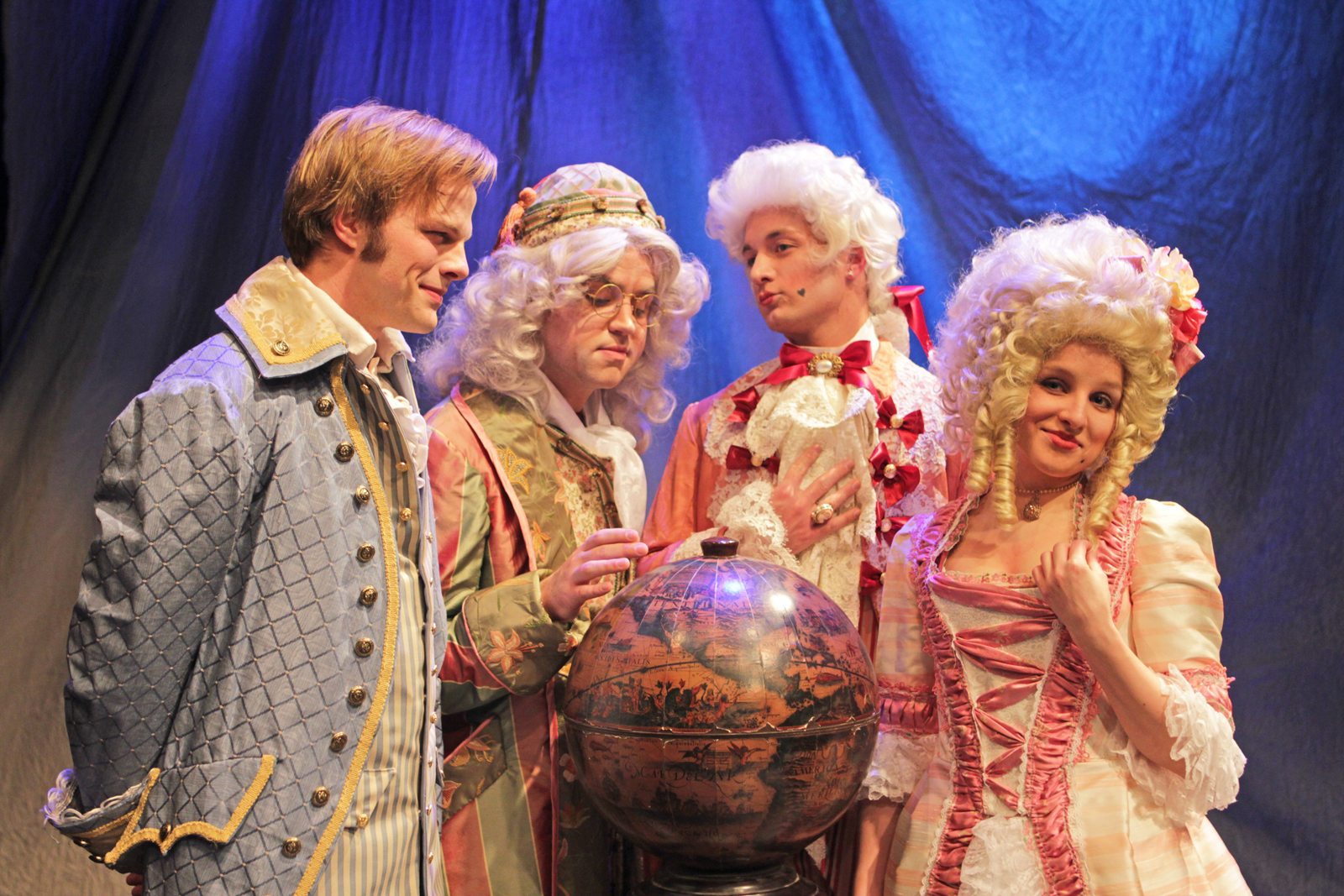 A "Candide" scene featuring Dr. Pangloss and his students Candide, Maximillian and Cunegonde.