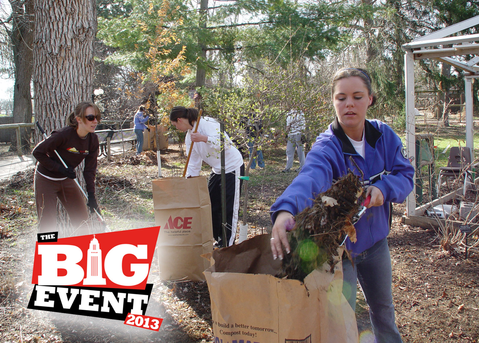 Students rake leaves at the Lincoln Children's Zoo. (University Communications file photo)