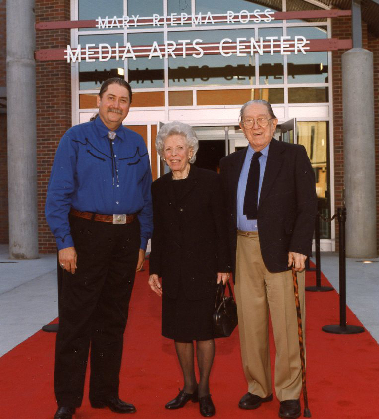 (From left) Danny Ladely, director of the Mary Riepma Ross Media Arts Center; Mary Riepma Ross; and Norman Geske, director emeritus of the Sheldon Museum of Art, pose during the dedication of the Ross in September 2003.