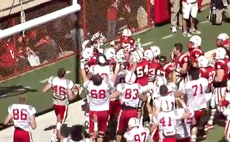 Husker football players lift Jack Hoffman, 7, after his 69-yard touchdown run in Saturday's Red-White Spring Game. (Huskers.com)