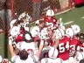 Husker football players lift Jack Hoffman, 7, after his 69-yard touchdown run in Saturday's Red-White Spring Game. (Huskers.com)