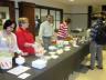 Anita Sarma, Deb Heckens, Steve Goddard, and LaRita Lang serving ice cream to students.