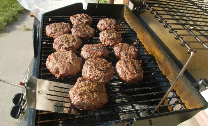 Hamburgers on a gas grill.  Photo courtesy of NU/IANR.