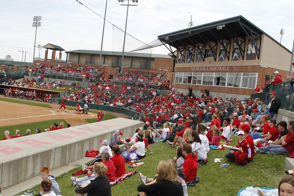 Fans watch the game prior to the 2012 "World's Largest Softball Tailgate" at UNL's Bowlin Stadium.