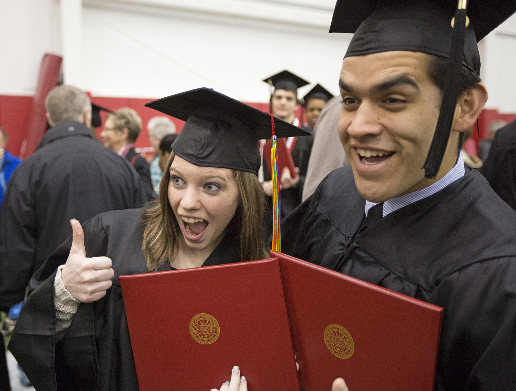 Marnee Royer of Kearney and Chris Espinoza of Bellevue make faces for a photo during the May 4 commencement ceremony in the Hawks Center. (Craig Chandler/University Communications)