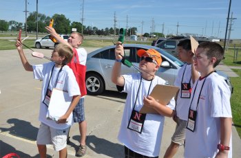 Campers conduct weather experiments during previous weather camps.