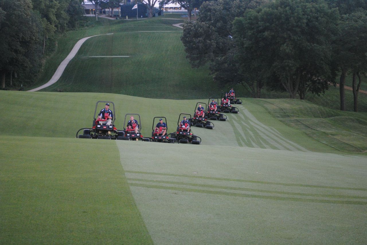  Crews work to maintain the Omaha Country Club course during the recent U.S. Senior Open.