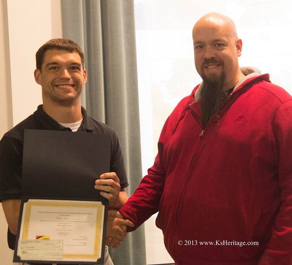Josh Mead accepting the award for best student presentation at the 40th Annual Kansas Herpetological Society (KHS) Meeting (photo credit: Larry Miller). 