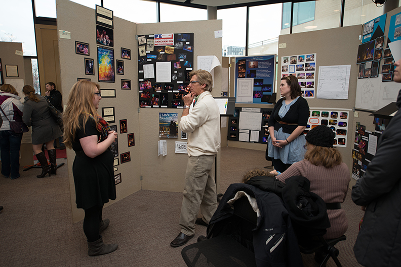 A student explains her design work to a faculty judge during last year's Design, Technology and Management Expo in the Lied Commons. Photo by Greg Nathan.
