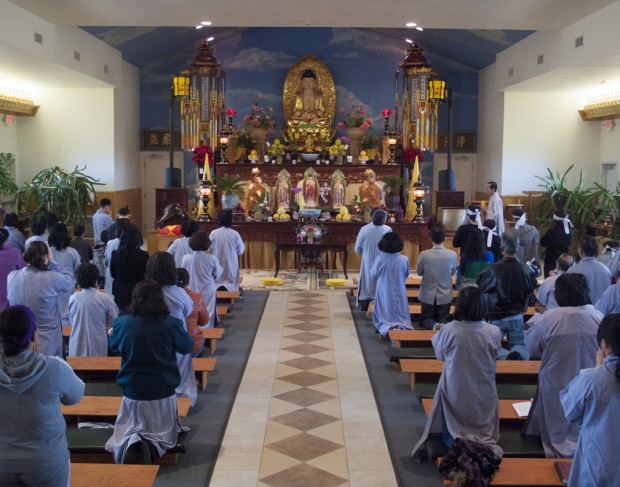 Members of the Ling Quang Buddhist Center, a Buddhist temple south of Lincoln whose congregation is almost entirely Vietnamese immigrants and their families, pray together on a Sunday morning. This photograph, by former student Dan Holtmeyer, is from his 