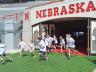 UNL Weather Campers rush the field at Memorial Stadium on June 11. Campers conducted a microclimate study of the facility. (Mekita Rivas | Natural Resources)