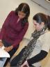 Stephanie Espy, left, goes over a problem with a student at the GMAT Strategy Workshop last February