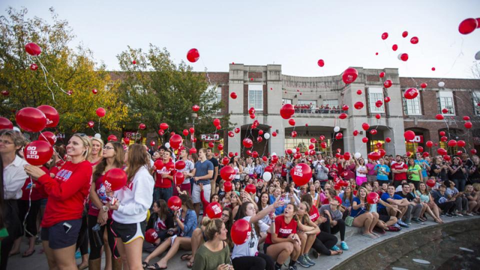 Participants in UNL's 2013 Homecoming festivities release balloons around Broyhill Fountain outside the Nebraska Union. Activities for UNL's 2014 Homecoming begin with a 5K fun run on Sept. 21. (Craig Chandler | University Communications)