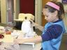 Pictured is a 4-H'er practicing beginning sewing skills at the 2014 "Jammie Jamboree" sewing workshop.