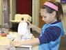 Pictured is a 4-H'er practicing beginning sewing skills at the 2014 "Jammie Jamboree" sewing workshop.