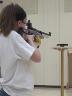 A 4-H'er practices with a precision-grade air rifle.