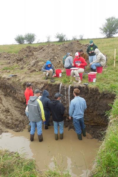 Members of the UNL Soil Judging Team analyze soils in a practice pit at the Region 5 contest in Ames, Iowa. (Photo courtesy of Becky Young)