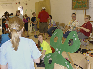 4-H clubs provide carnival type games at the annual Kiwanis Karnival. Pictured is the South Prairie Wrangler's club booth at 2014 Karnival.