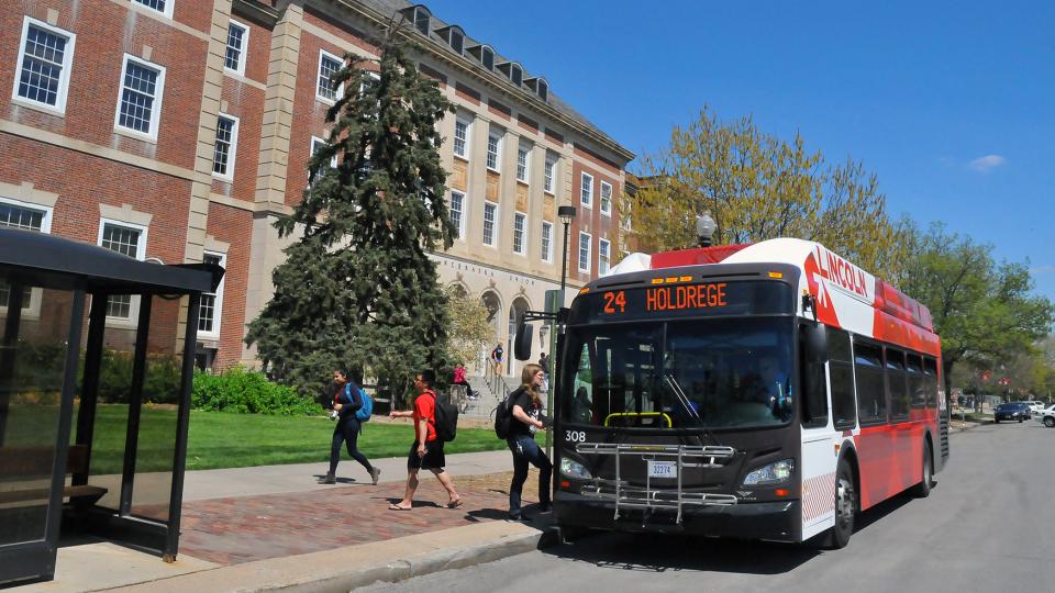 An intercampus bus makes a stop outside the Nebraska Union on April 29. UNL add two new bus routes in the fall, connecting City and East campuses with Nebraska Innovation Campus. (Troy Fedderson | University Communications)