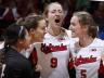 Husker volleyball players celebrate during a match. UNL faculty and staff have until June 12 to submit applications to purchase season tickets for the Cornhusker volleyball team's 2015 season.