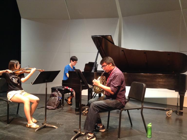 The Onyx Trio rehearses, featuring Sarah Ng, violin; Yongwhi Lee, piano; and Miguel Villarreal, horn.