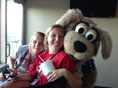 : Emma Zeller and Hannah Thomazin, both of Columbus, NE, with Homer, the Saltdogs’ mascot Photo credit: Ruth Brown