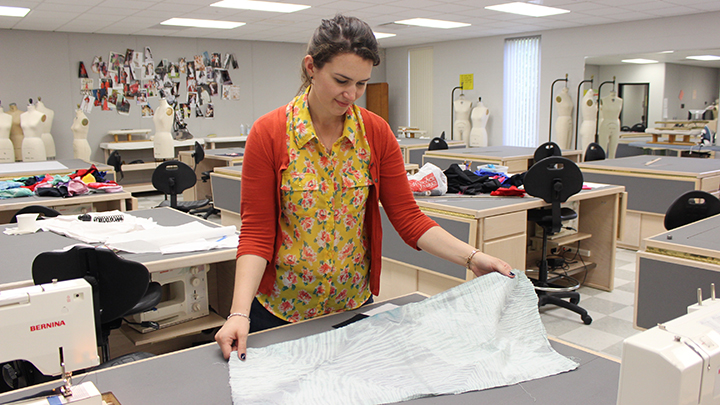 Camille Hawbaker shows a sample of fabric dyed using the shibori technique