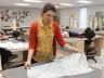 Camille Hawbaker shows a sample of fabric dyed using the shibori technique