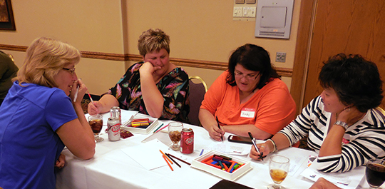 OPS teachers work on a problem at the Math Teachers Circle kickoff in 2014