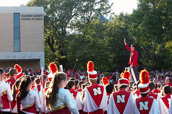 University of Nebraska President Hank Bounds greets the Cornhusker Marching Band on Sept. 12. Photo by Hannah Vanderslice.
