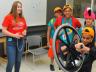 Savanna McDonald (far left), a senior physics major, demonstrates the principles of a gyroscope during a science, technology, engineering and mathematics exposition in Jorgensen Hall during the Science Olympiad National Tournament in May. UNL has received