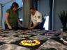 Curator of Collections Carolyn Ducey and Fire Inspector Rick Campos look at the Lincoln Fire and Rescue T-shirt quilt, which will be unveiled at the International Quilt Study Center & Museum during First Friday.