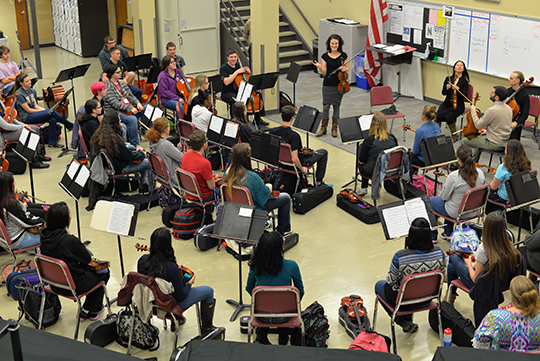 The Chiara String Quartet perform for orchestra students at Lincoln Northeast High School on Dec. 2. Photo by Michael Reinmiller.