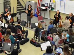 The Chiara String Quartet perform for orchestra students at Lincoln Northeast High School on Dec. 2. Photo by Michael Reinmiller.