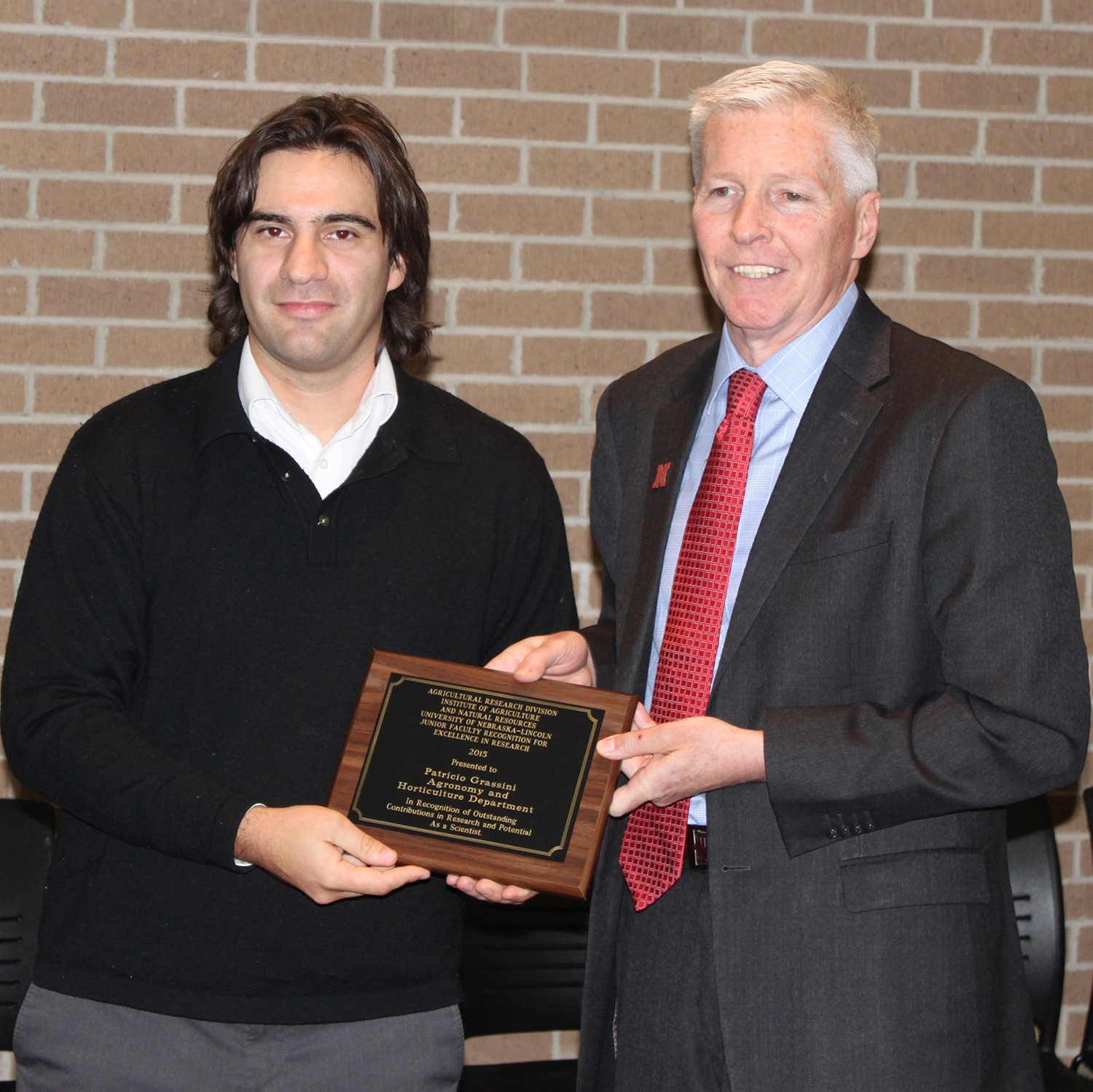 Grassini (left) honored with the Junior Faculty for Excellence in Research Award given by ARD Dean Archie Clutter.