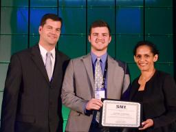 Jeff Lenihan (middle) is awarded a SAFE scholarship, at the Sports Turf Managers Association national conference.