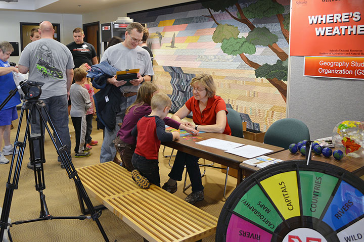 Milda Vaitkus, project manager in UNL's School of Natural Resources, runs the "Where's the Weather" booth during the 2014 Weatherfest. The 16th annual Weatherfest will take place from 9 a.m. to 2 p.m. and the Central Plains Severe Weather Symposium will r
