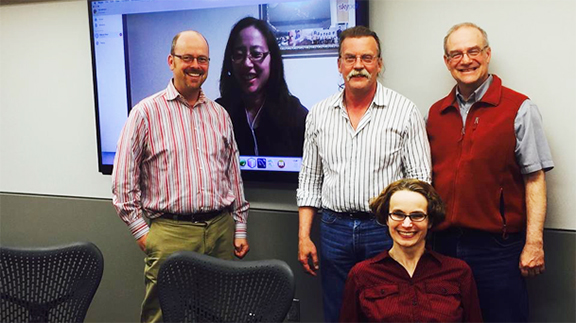 Dottie Bussman (front) with her dissertation committee (L-R) Ted Hamann, Elaine Chan (on screen), Karl Hostetler and Robert Brooke.