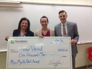 Amber Vlasnik (center) receives her award at Lincoln High from the LPS Foundation.