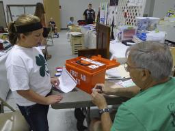 A 4-H member discusses her First Aid Kit with the judge at the 2015 Lancaster County Super Fair.