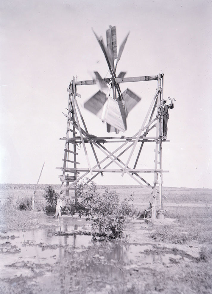 E.H. Barbour, Nebraska State Geologist, uses an anemometer to measure the windspeed and power generated by this windmill in 1898 in Nebraska. This photo and about 40 others are on display at Love Library South, 1248 R St., Lincoln, as part of the exhibit 