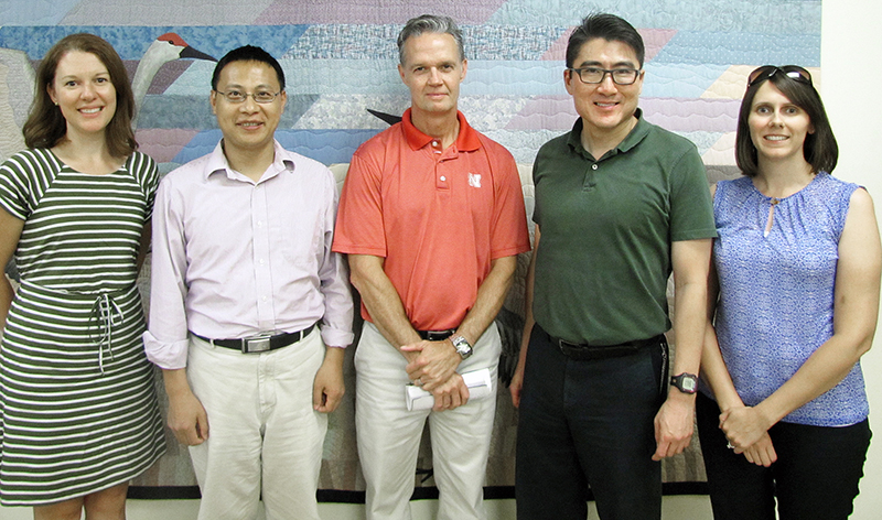 From left, Martha Shulski, Zhenghong Tang, Frank Uhlarik, Tarik Abdel-Monem and Natalie Umphlett recently were awarded $200,000 for a project analyzing climate data for cities planning for extreme weather events. | Courtesy photo