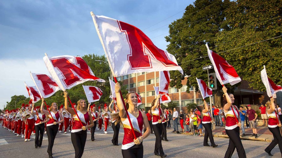  The Cornhusker Marching Band marches down 16th street during the 2015 Homecoming parade. The 2016 parade is 6 p.m. Sept. 30. | University Communications