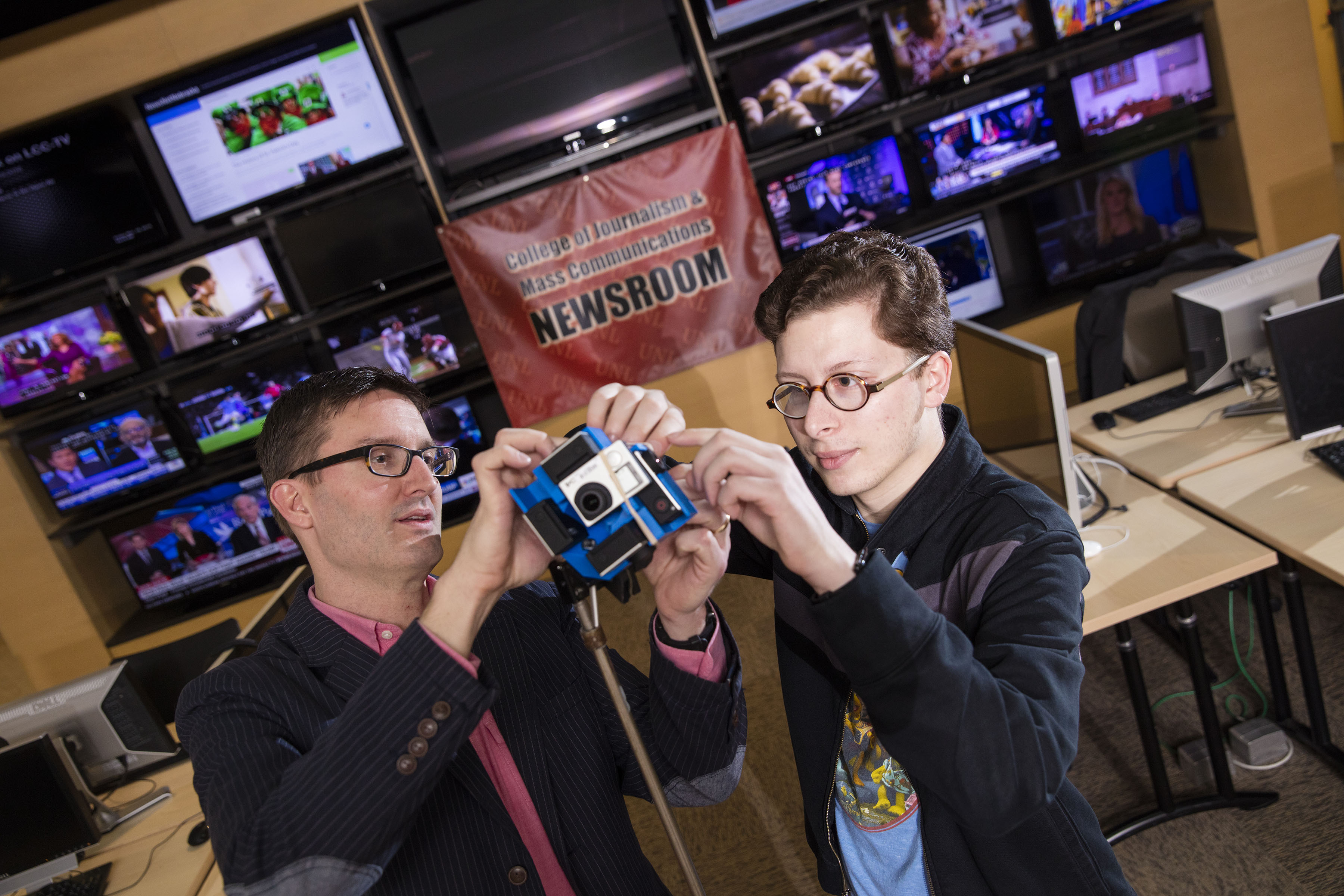 Professor Matt Waite and student Tony Papousek work on 360-degree video project