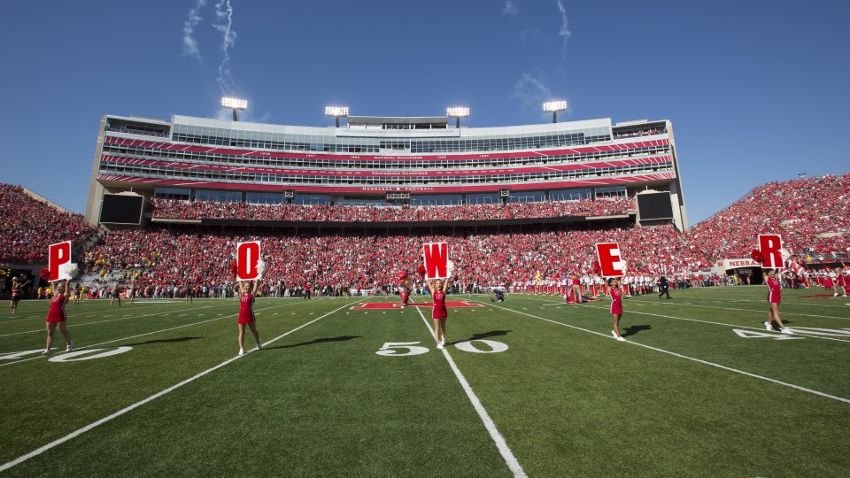 Nebraska cheerleaders take the field for a Husker Power cheer prior to the 2015 homecoming game in Memorial Stadium. Homecoming week activities this year culminate in the Huskers' game with IIllinois on Oct. 1. |  Craig Chandler, University Communication