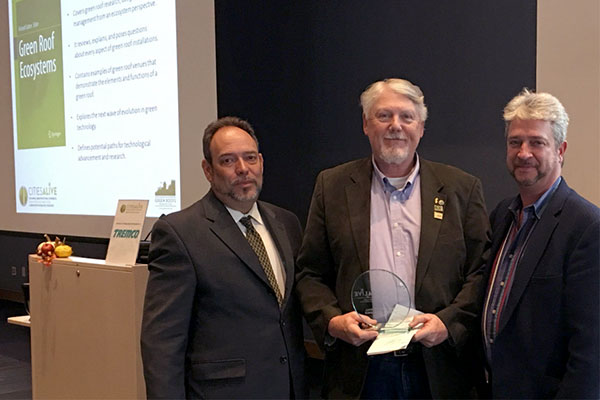  Richard Sutton receives the Green Roof Excellence Award for Research from Jeffrey Bruce, left, FASLA Chairman of the Board of Directors of GRHC, and Steven Peck, right, Honorary ASLA, President and Founder of GRHC. 