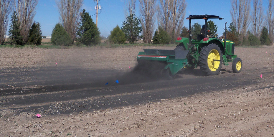 Char is spread onto research plots at the Mitchell Ag Lab, several miles north of the University of Nebraska Panhandle Research and Extension Center. The fine power is spread with a golf-course spreader.