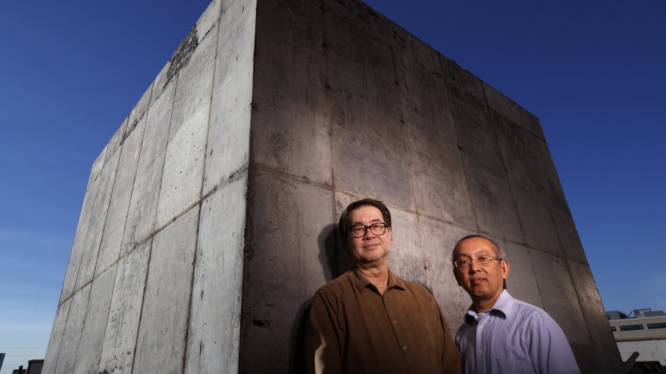Nebraska engineers Christopher Tuan (left) and Lim Nguyen have developed a cost-effective concrete that shields against damaging electromagnetic energy. Electronics inside structures built or coated with this concrete are protected from electromagnetic in