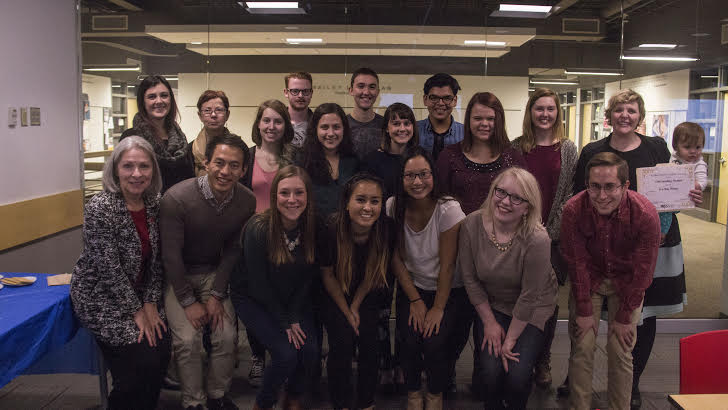 PRSSA members pose for a photo at the end of their holiday party and award ceremony.