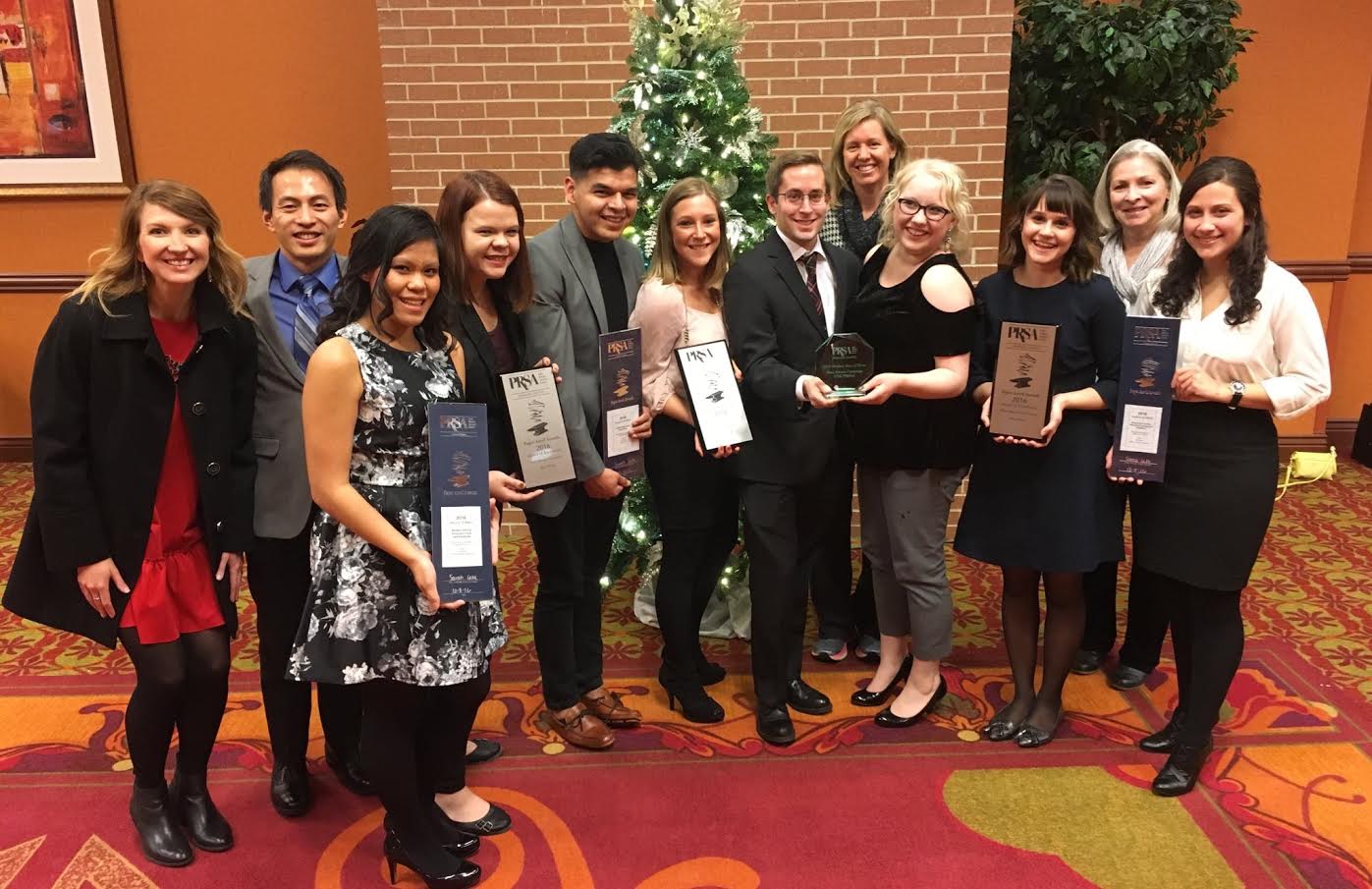 CoJMC students pose with the awards they won at the PRSA Nebraska Paper Anvil Awards Gala.